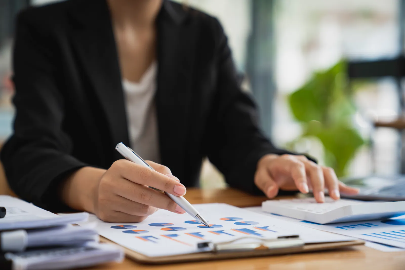 Financial specialist reviewing and signing client documents